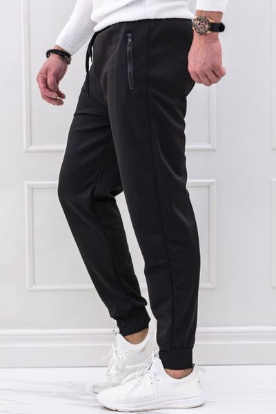 pantaloni da uomo in felpa nera con tasche con cerniera