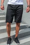 Pantaloncini neri con strisce laterali e tasche con cerniera